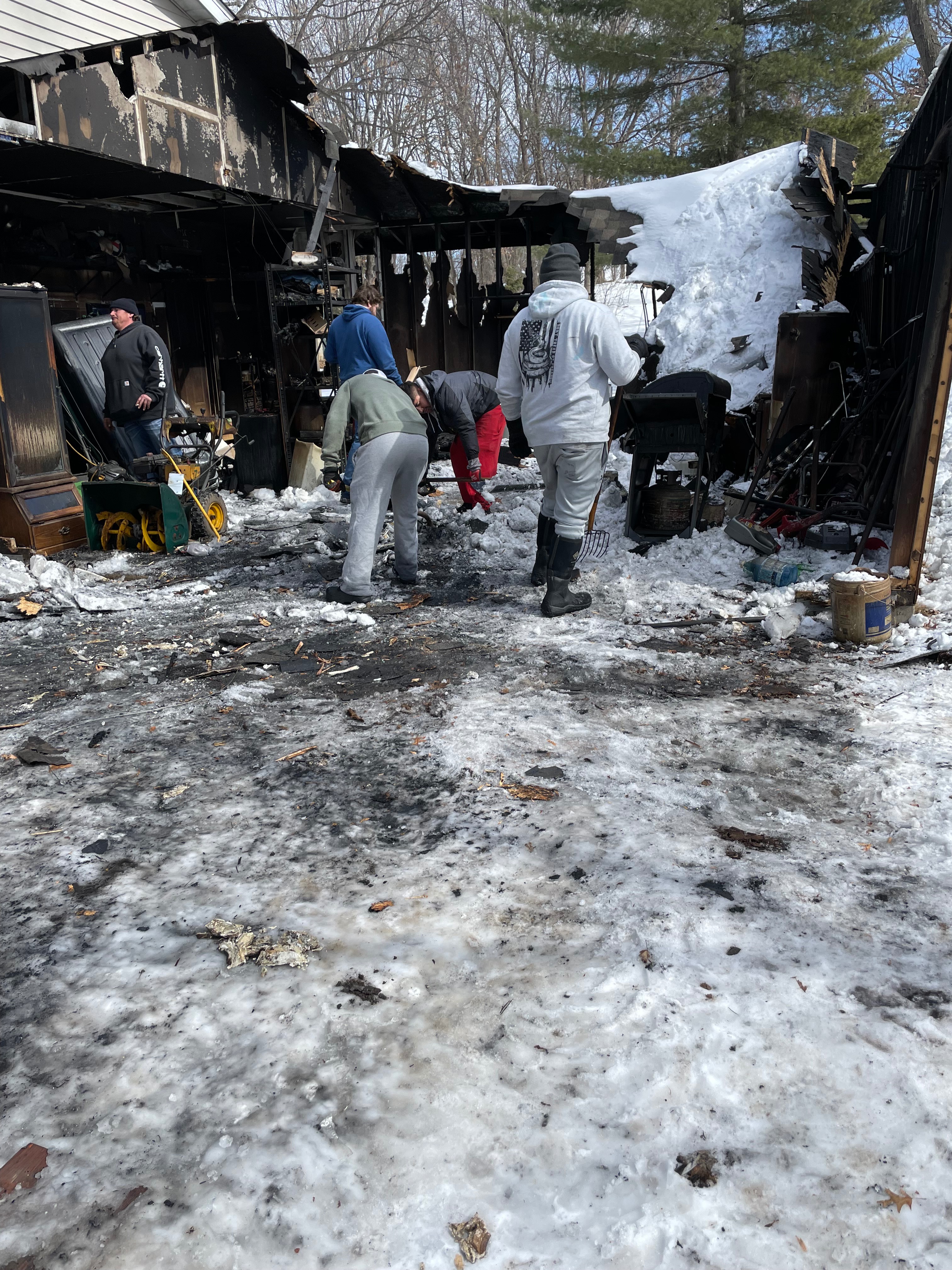 American Restores Group fire damage restoration crew working in winter conditions with severe structural damage cleanup Minneapolis Minnesota